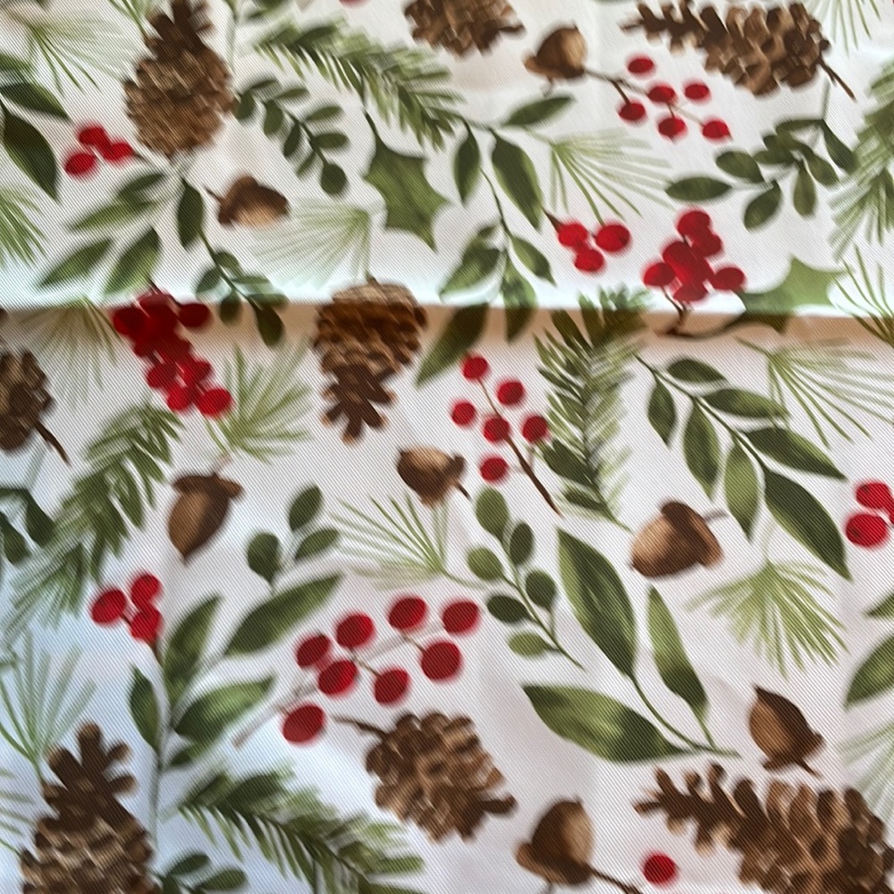 Arctic Holiday Four Napkins with Christmas Tree napkin rings.